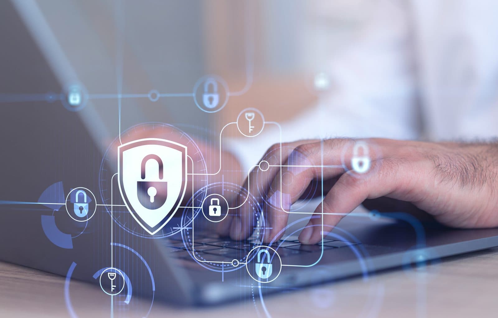 A glowing shield with a padlock and connected lock and key icons hovering over a laptop keyboard as someone types, representing Vervoe's data protection and security practices