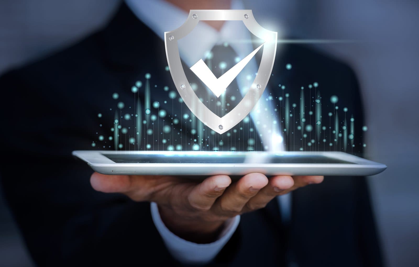 A shielded checkmark hovering above a tablet, representing Vervoe's data protection and security practices