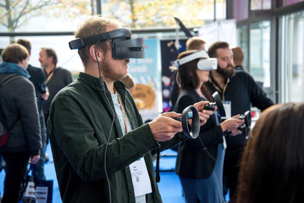 Man using virtual reality recruitment tools at an open day