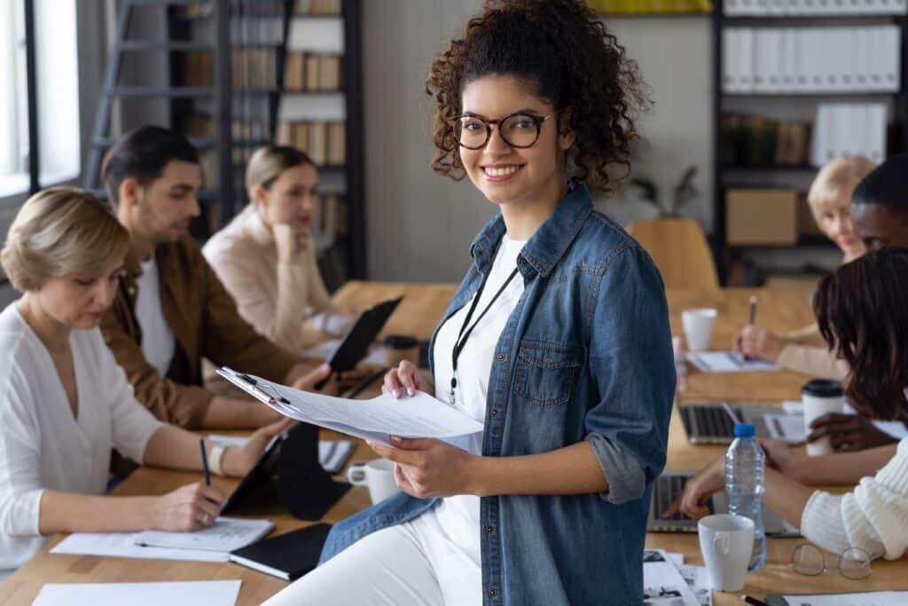 A woman among a team in a meeting